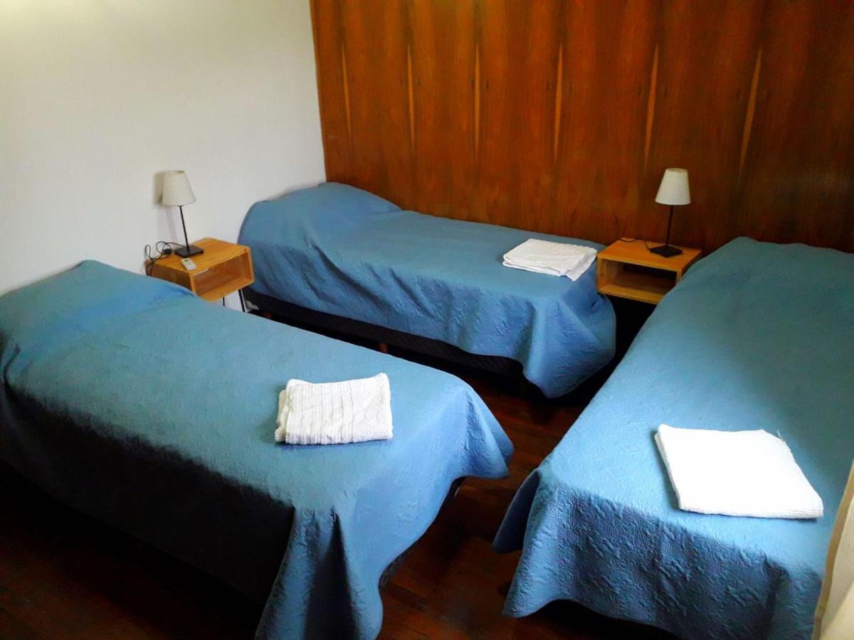 Quarto Triplo com Banheiro Compartilhado