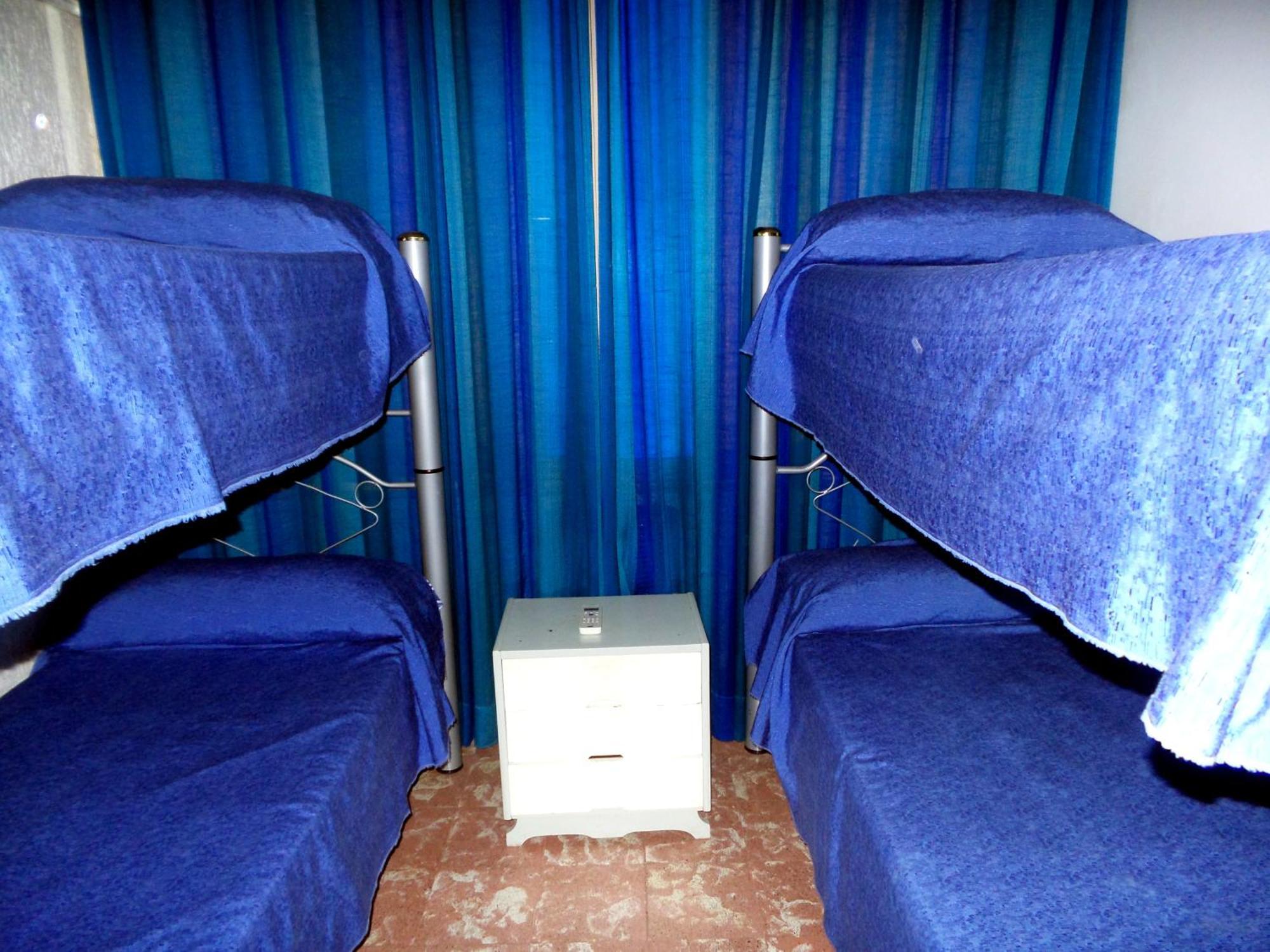 Quarto Quádruplo com Banheiro Compartilhado