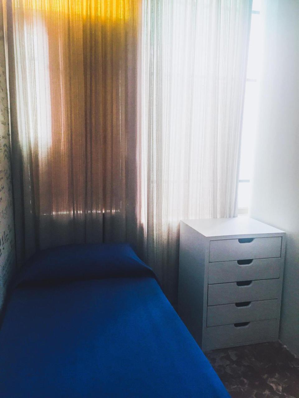 Quarto Individual com Banheiro Compartilhado